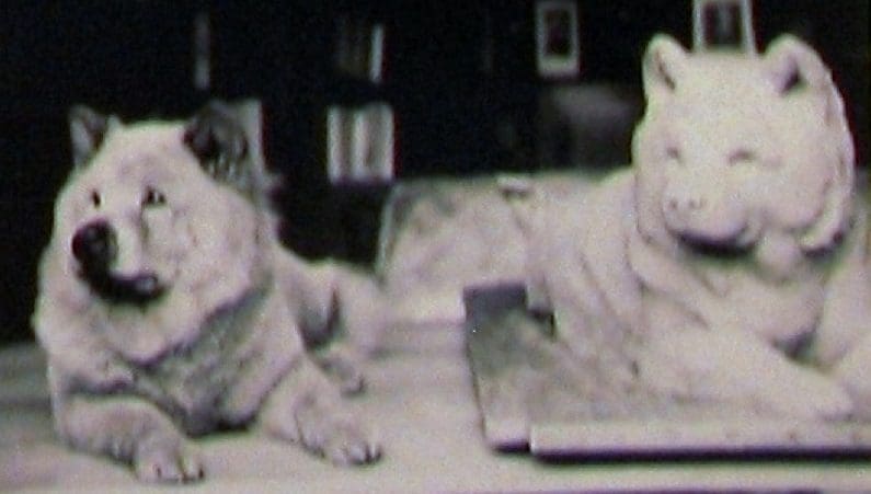 Topsy next to his sculpture